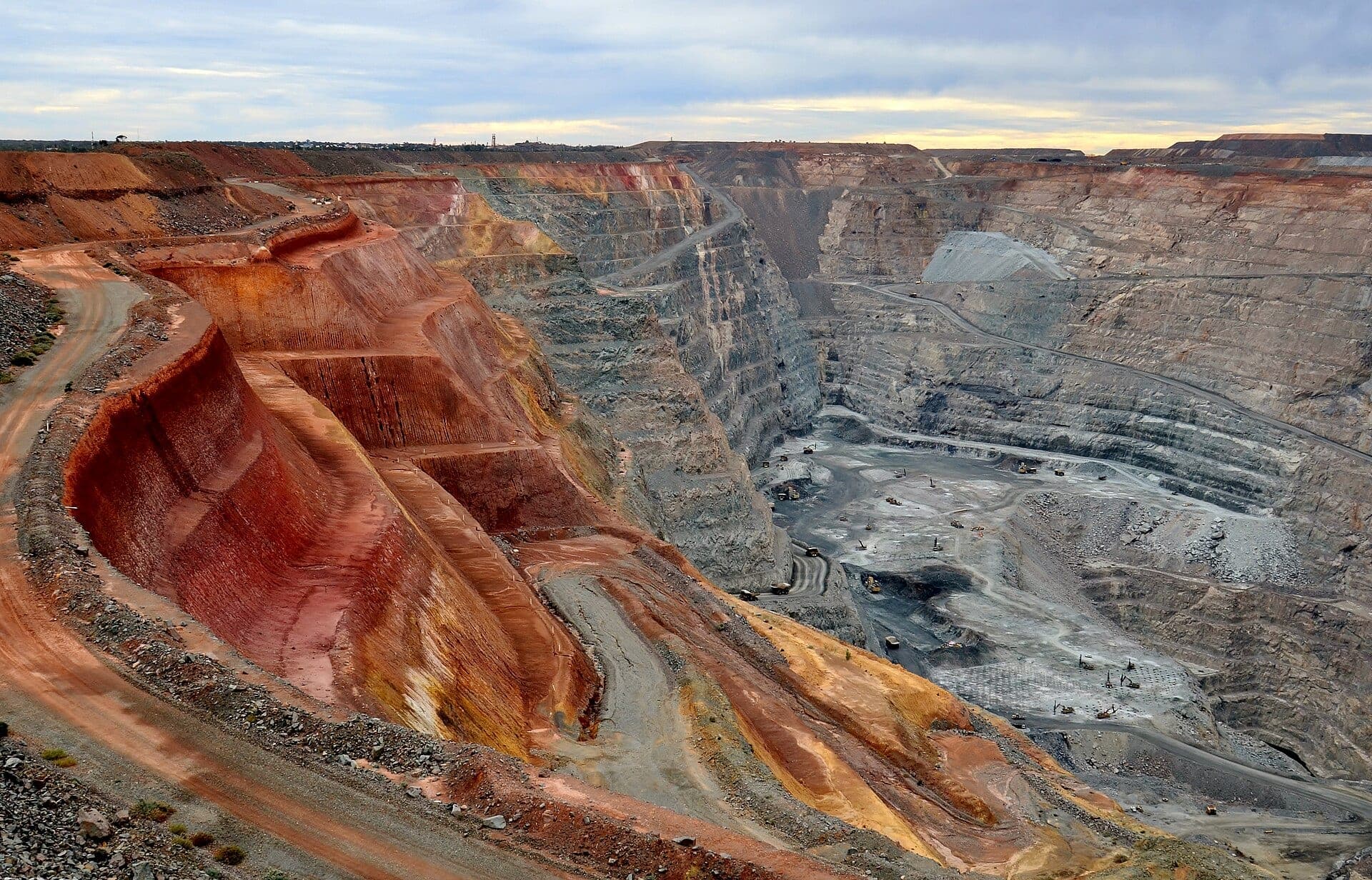 Terraced benches of the Fimiston Super Pit gold mine at Kalgoorlie, Western Australia, with haul roads winding to the pit floor